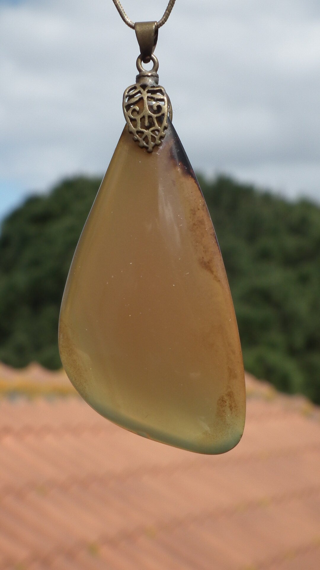 Sumatra amber pendant with bronze bail