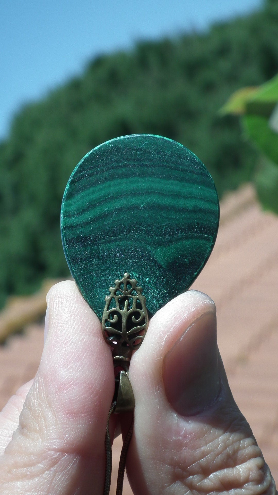 Malachite pendant with bronze bail