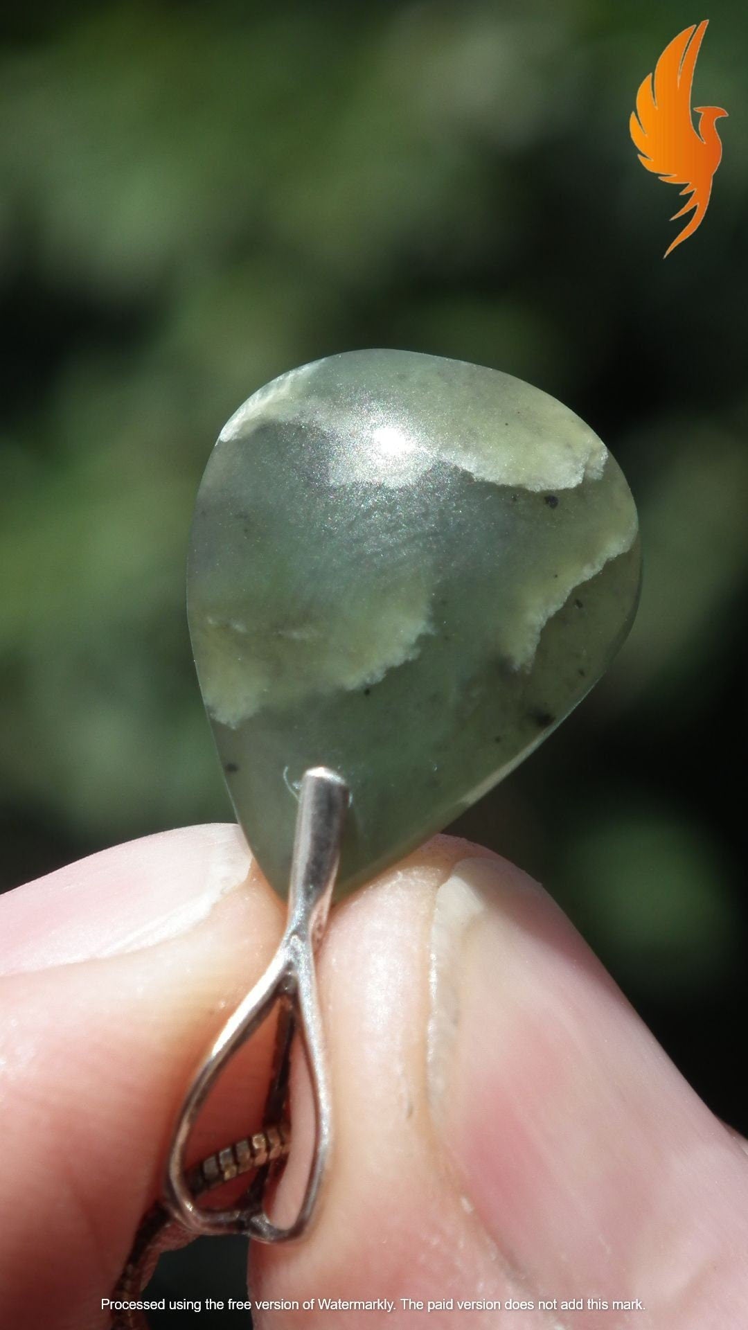 Nephrite jade pendant with sterling silver bail