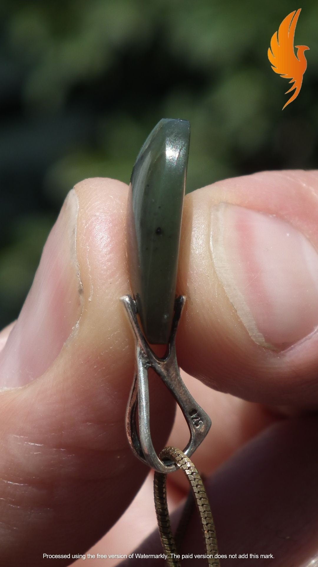 Nephrite jade pendant with sterling silver bail