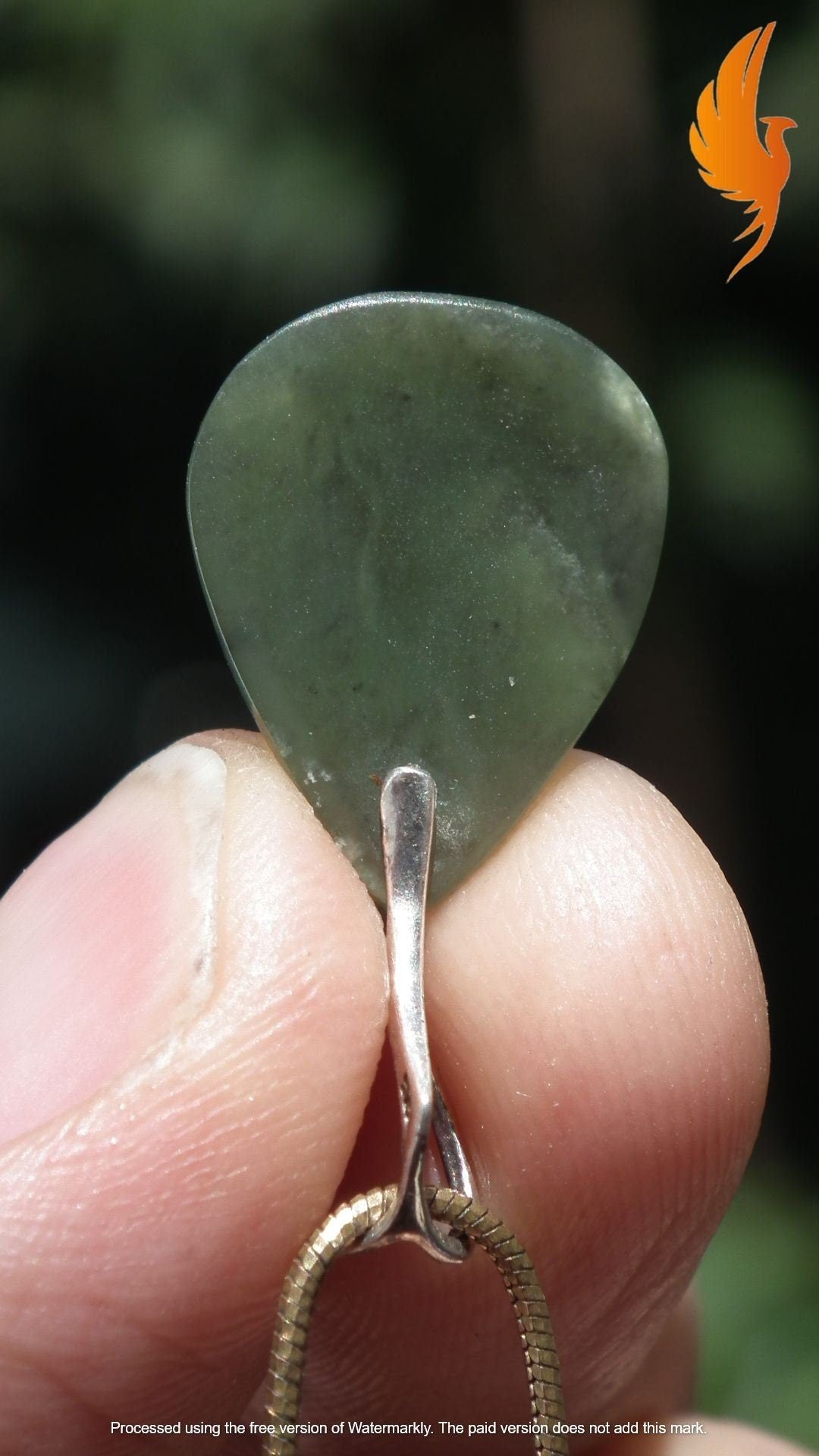 Nephrite jade pendant with sterling silver bail