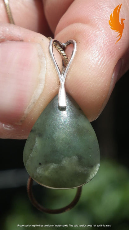 Nephrite jade pendant with sterling silver bail