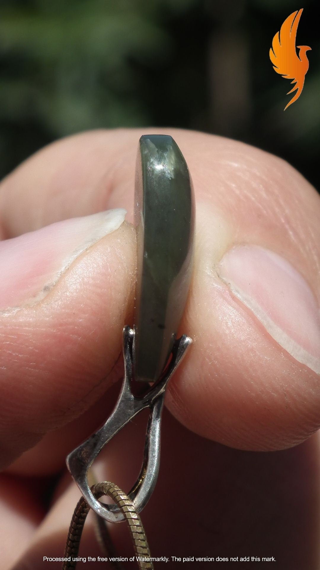 Nephrite jade pendant with sterling silver bail