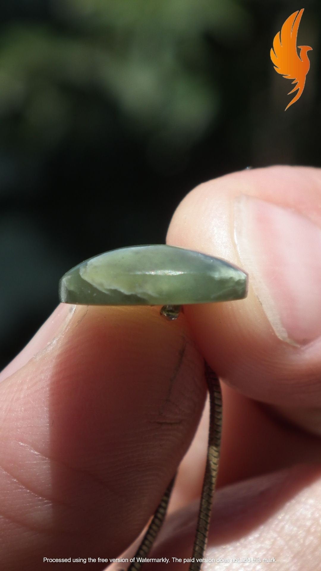 Nephrite jade pendant with sterling silver bail