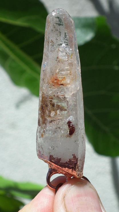 Uv reactive crystal pendant // Petroleum quartz // Terminated quartz