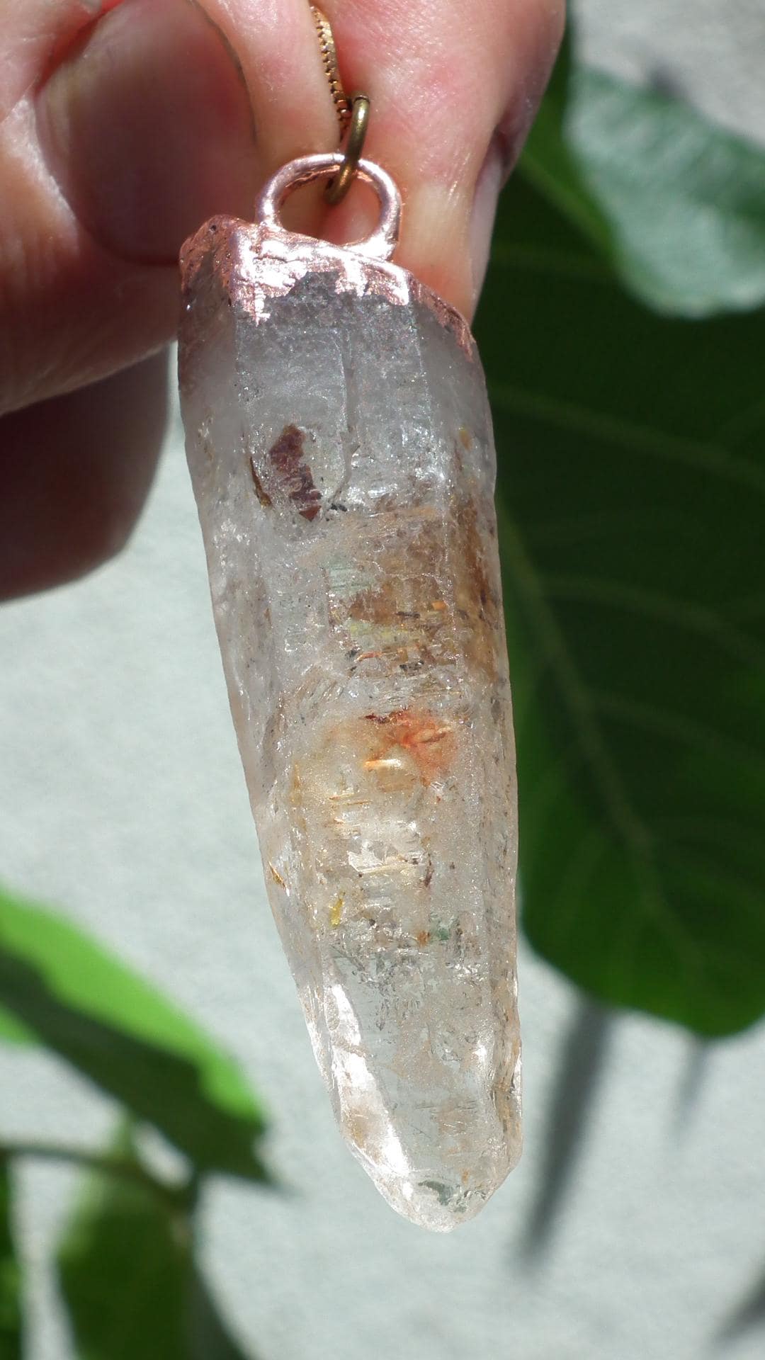 Uv reactive crystal pendant // Petroleum quartz // Terminated quartz