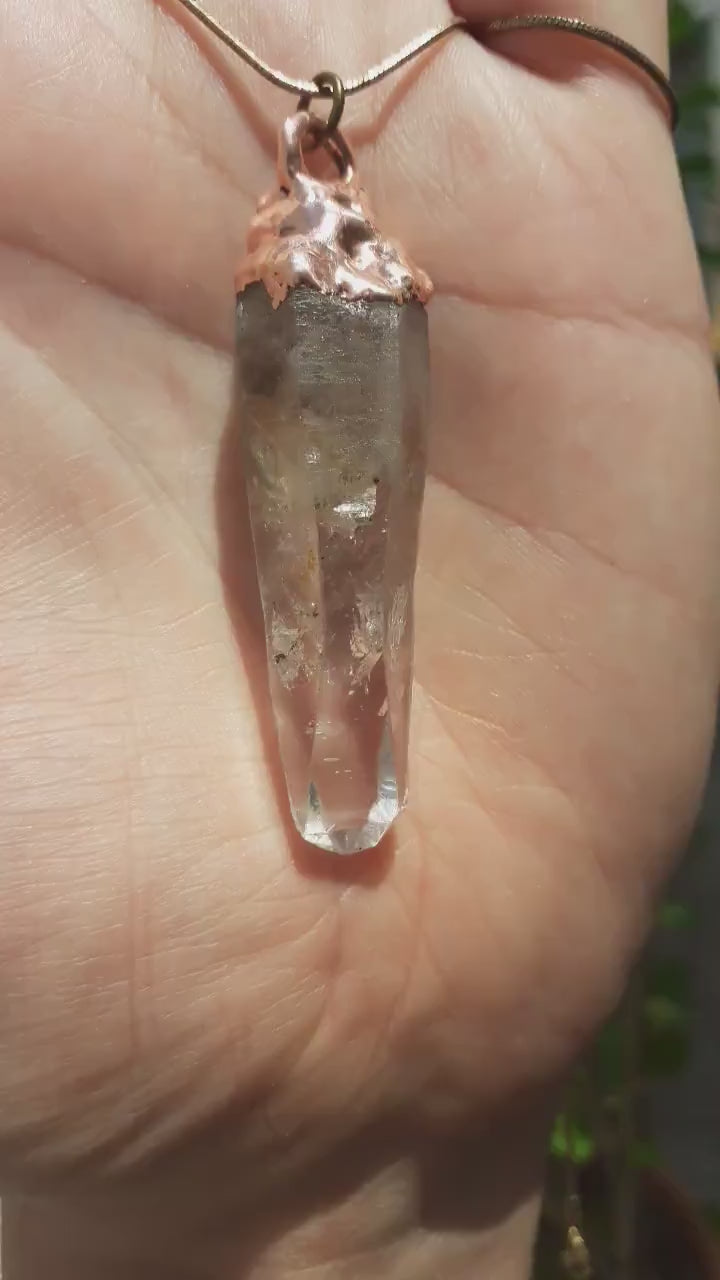Uv reactive crystal pendant // Petroleum quartz // Terminated quartz