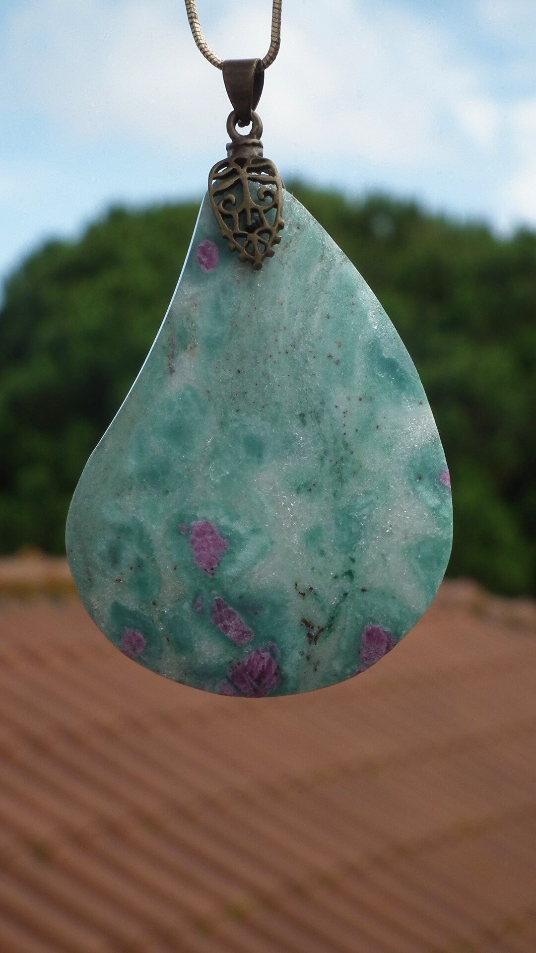 Ruby in fuchsite pendant with bronze bail