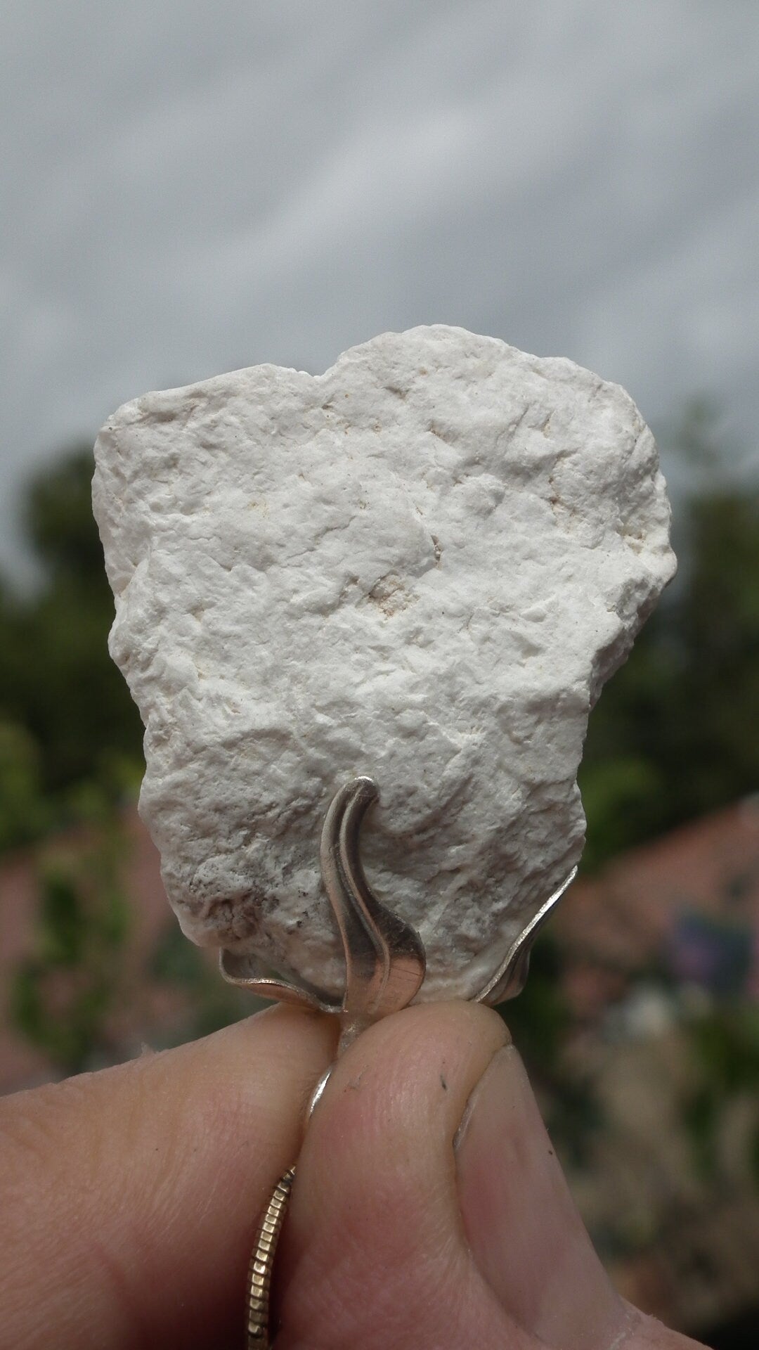 Natural rough magnesite pendant with silverplated bail