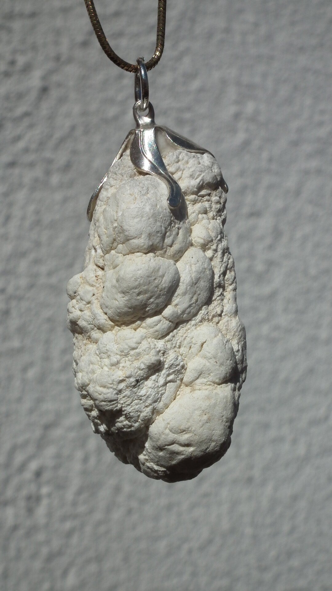 Natural rough magnesite pendant with silverplated bail