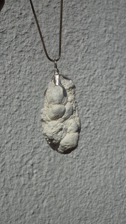 Natural rough magnesite pendant with silverplated bail