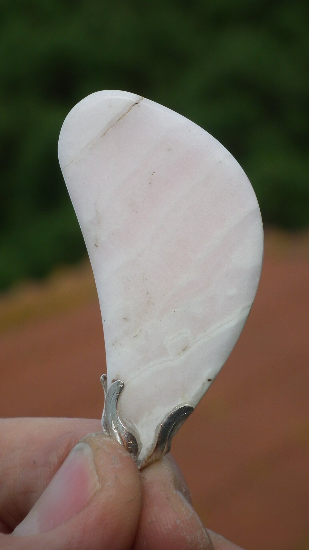 Mangano calcite pendant with silverplated